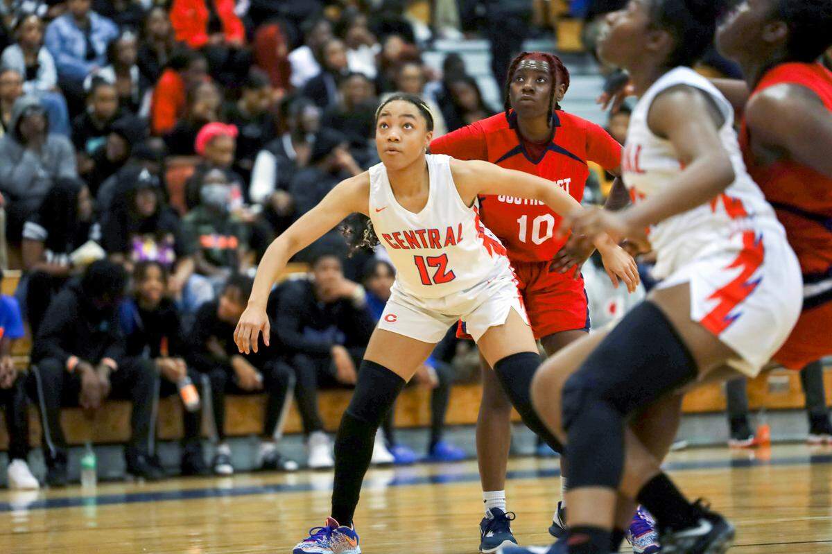 Central’s Tayelor Davis boxes out Southwest’s Khaleah Johnson at Central High School in Macon on Feb. 10.