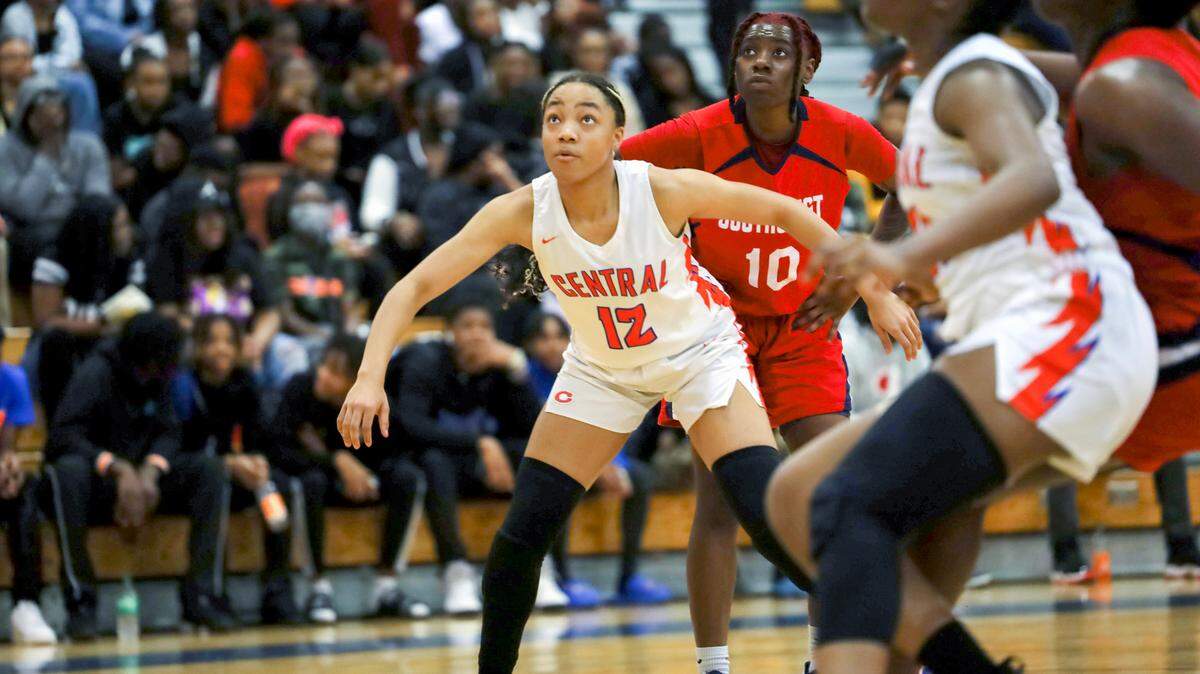 Central’s Tayelor Davis boxes out Southwest’s Khaleah Johnson at Central High School in Macon on Feb. 10.