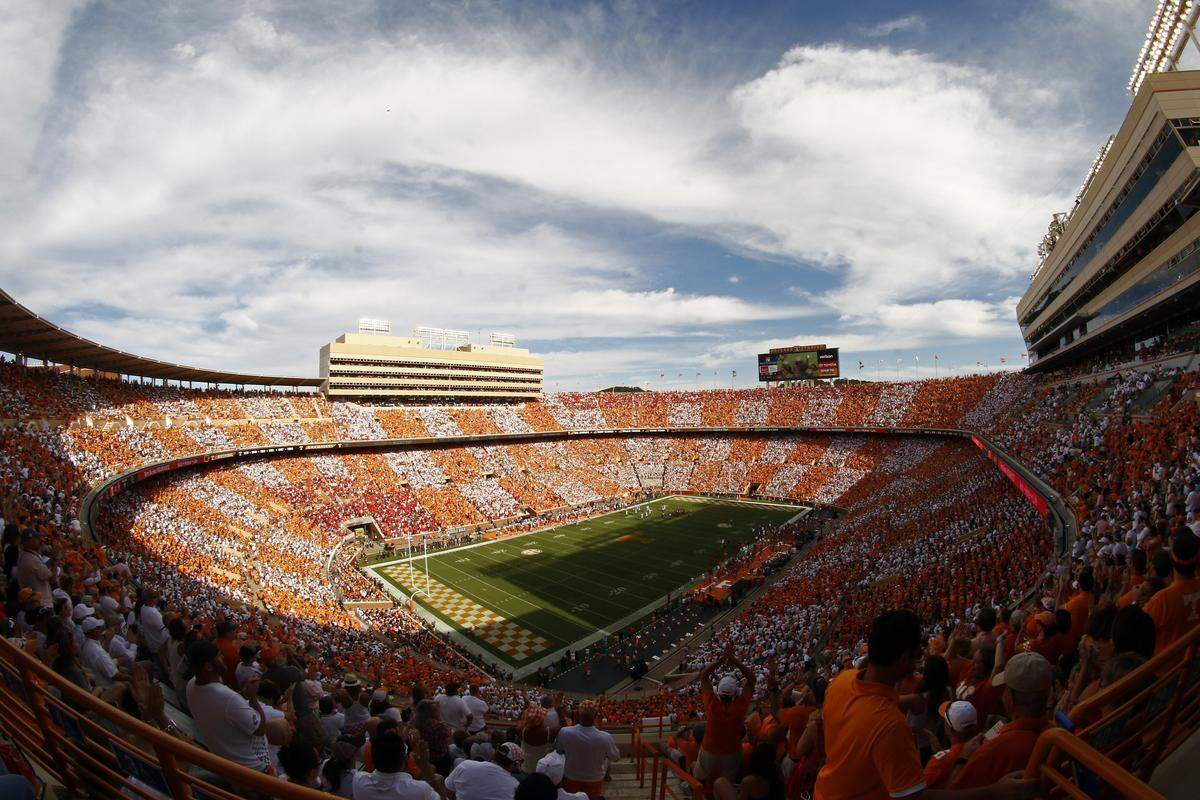 In this photo taken with a fish-eye lens, Neyland Stadium is seen with fans forming the checker board pattern during the first half of an NCAA college football game between Tennessee and Georgia Saturday, Sept. 30, 2017, in Knoxville, Tenn.