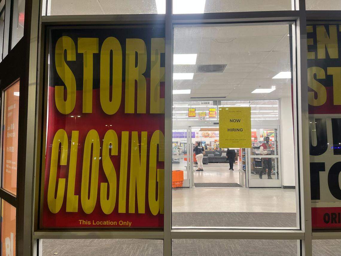 The Big Lots in Macon at 195 Tom Hill Sr. Blvd. posted both “store closing” and “now hiring” signs on its storefront.
