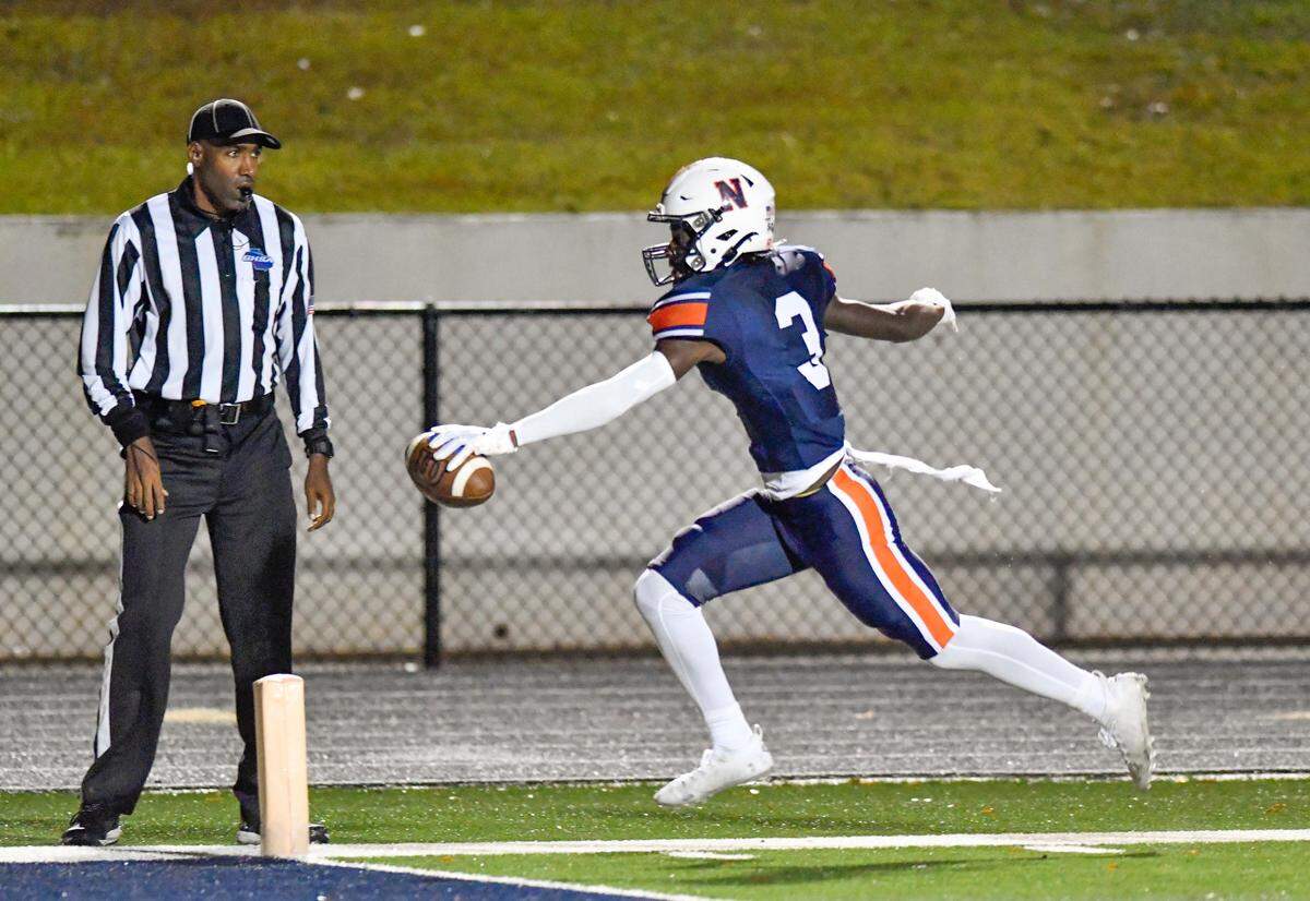 Northside receiver Keron Milton (3) stretches for the end zone for a touchdown during the Eagles’ first round playoff game against Glynn Academy.