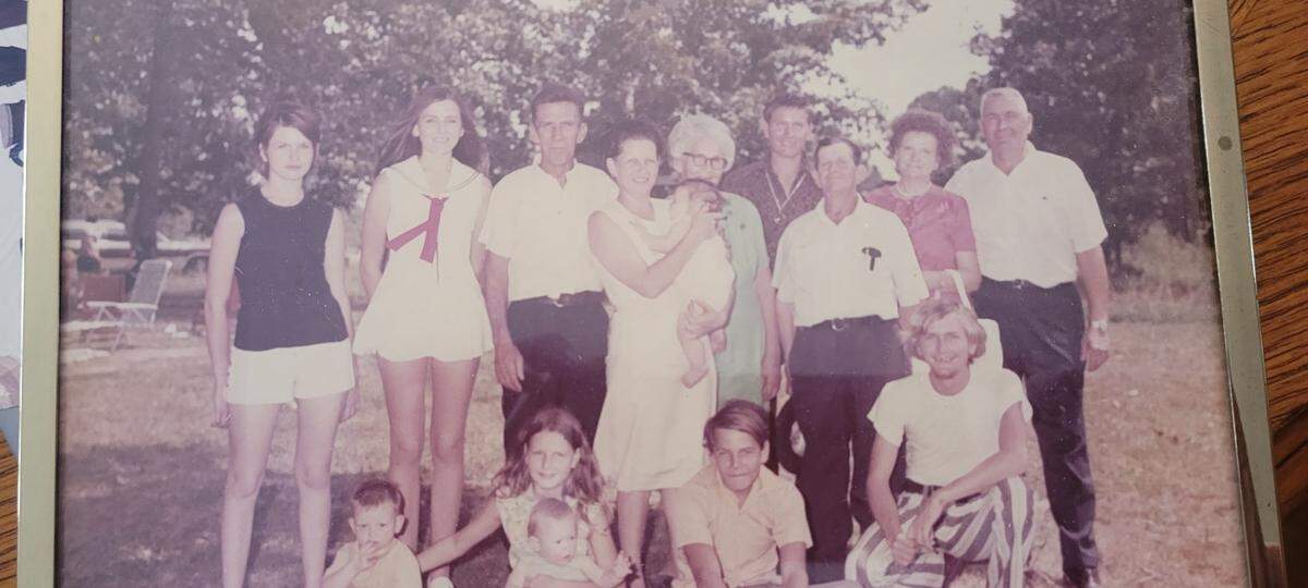 Barbara Crenshaw stands in a white dress and red tie, surrounded by family members at a family reunion on Sunday, Aug. 6, 1972. Crenshaw was found dead on March 19, 1996, at Echeconnee Creek in Macon, Ga.