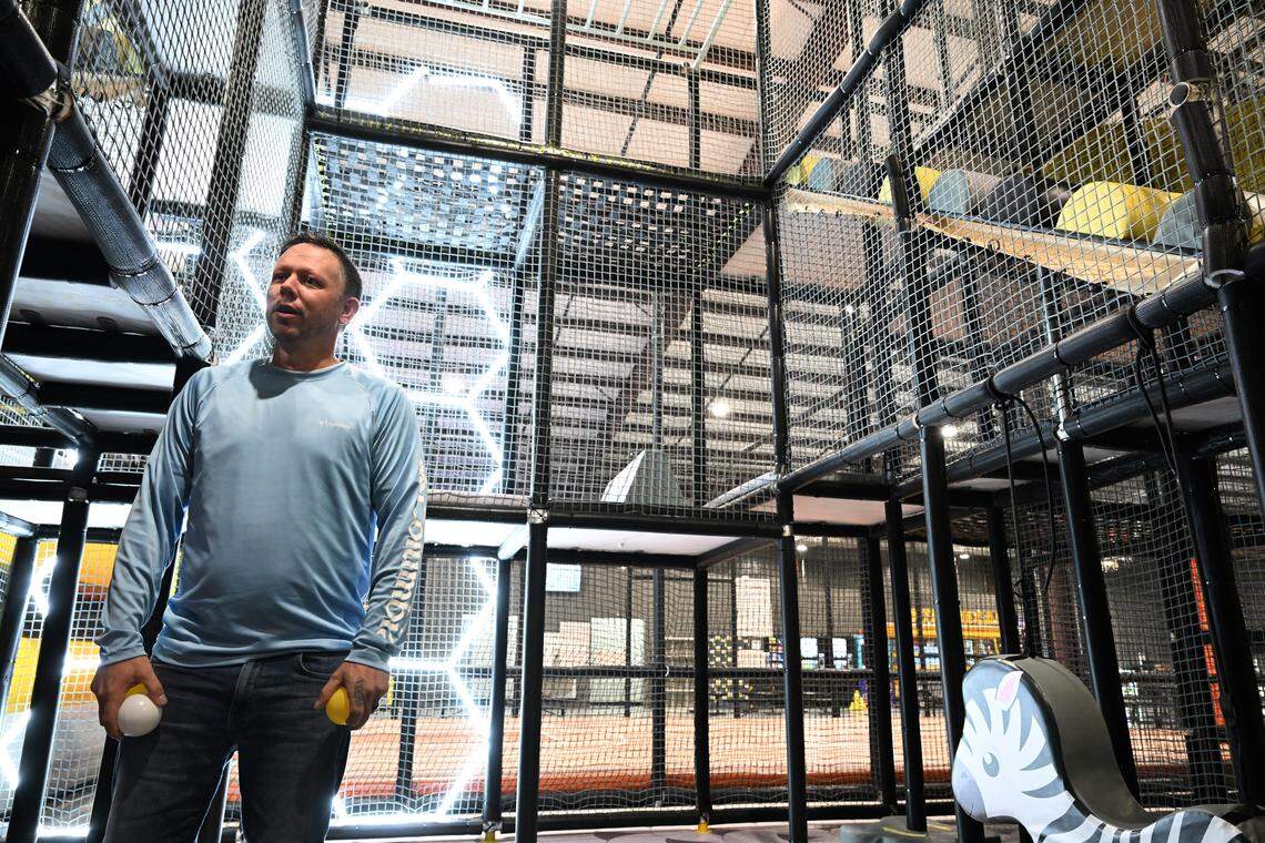 Co-owner Todd Buckelew stands on the ground floor of a three-story playground inside of the new Xtreme Air Mega Park in Warner Robins. This toddler area includes a bouncing ball floor, board activities and four horse slings to ride on. A ball pit is nearby.