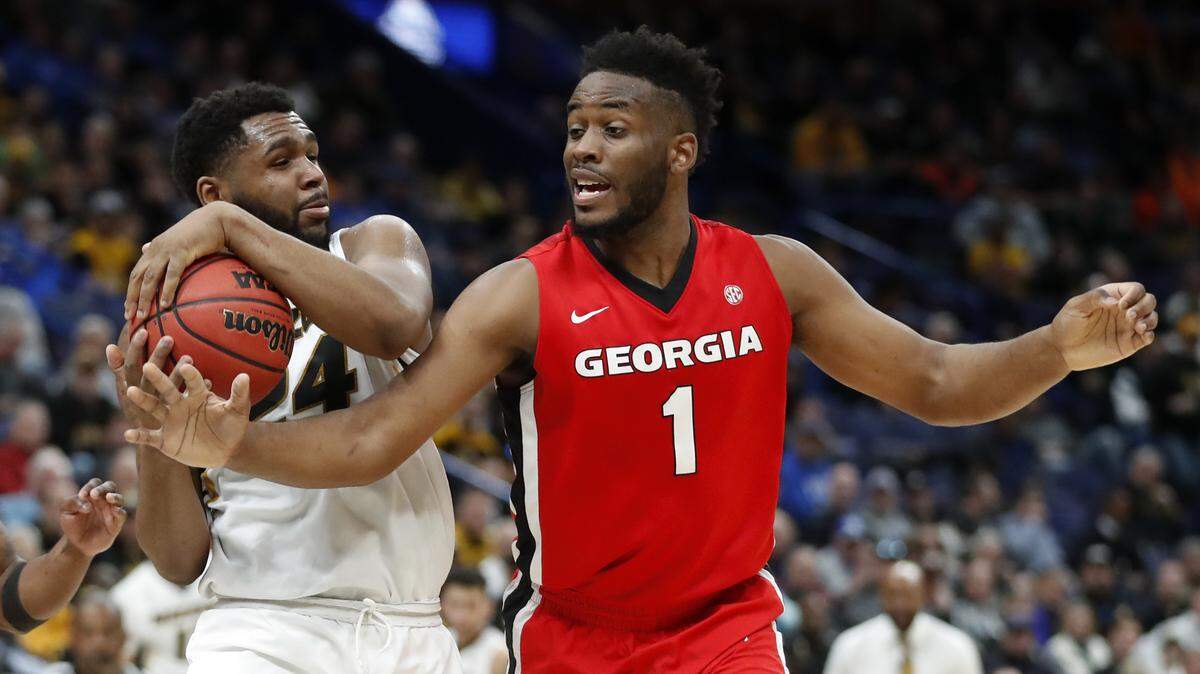 Missouri's Kevin Puryear and Georgia's Yante Maten go at it during their teams' second-round matchup in the SEC Tournament in St. Louis.