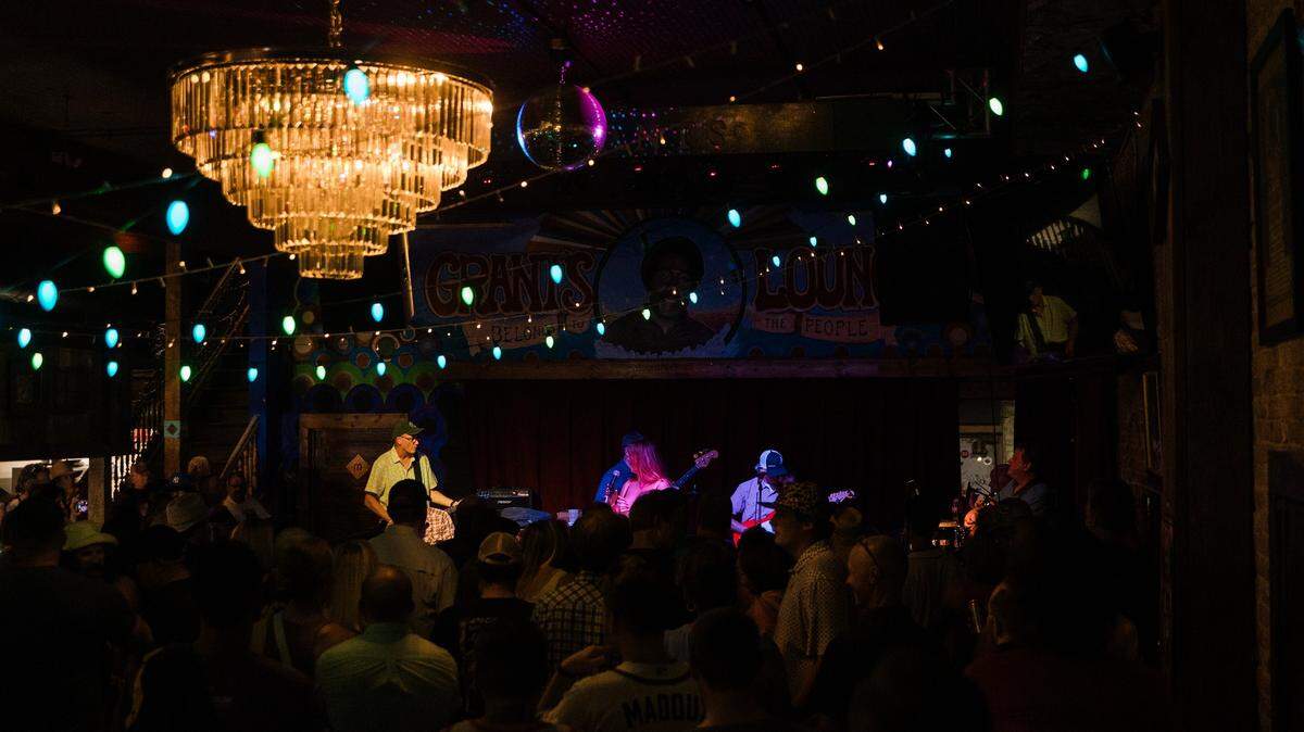 A crowd watches the stage of Grant’s Lounge, as one of the many bands attending the 2024 Bragg Jam Concert Crawl performs.