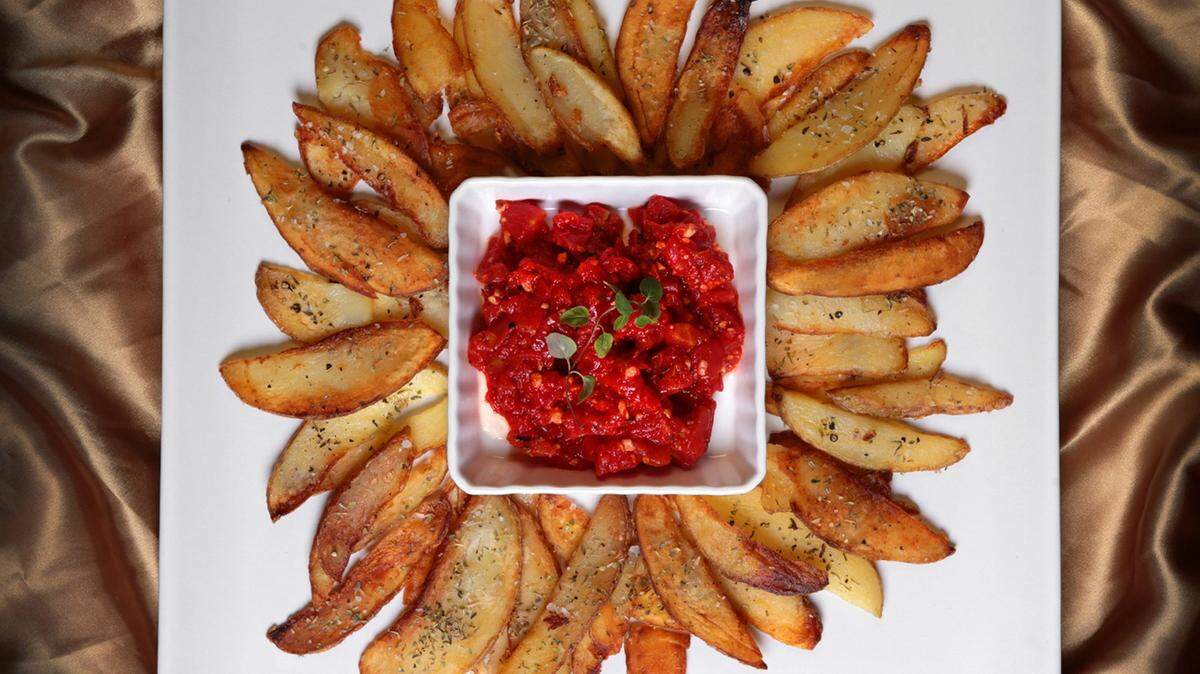 Fried Potatoes with Tomatoes and Oregano are a Mediterranean-inspired treat.