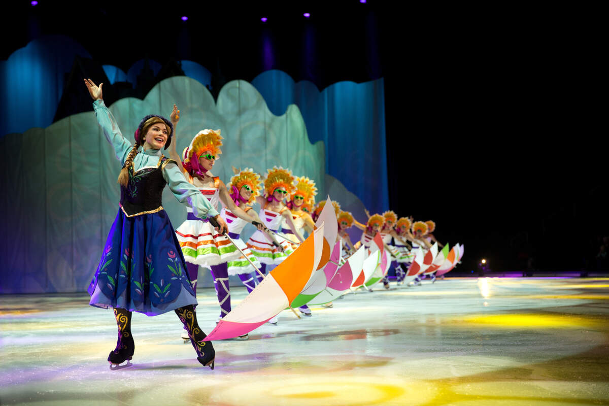 Disney on Ice characters from the movie “Frozen” glide across an ice rink on tour.