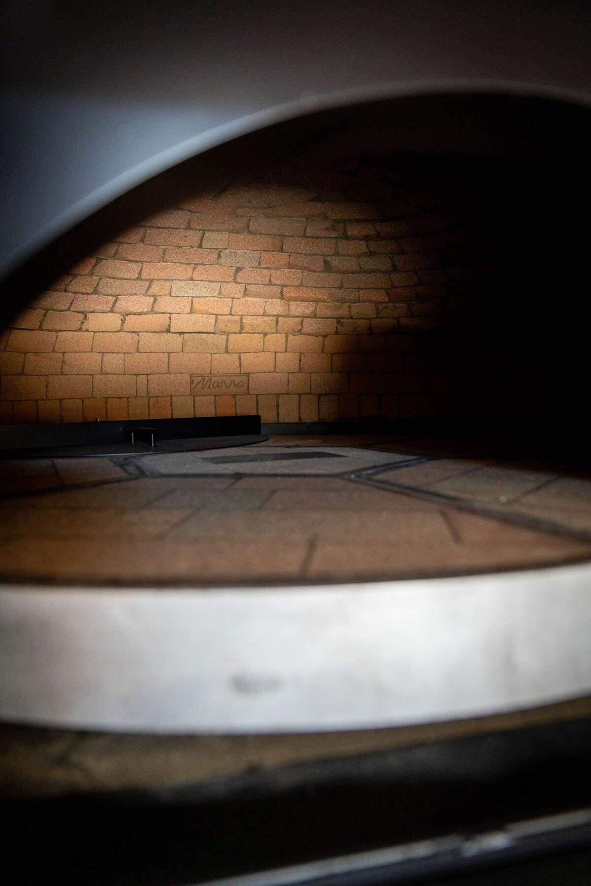 Trattoria di Napoli features a custom-made Neapolitan pizza oven from manufacturer Marra Forni. The 4,500 pound oven was built on site brick by brick. The bricks are from Naples, Italy.