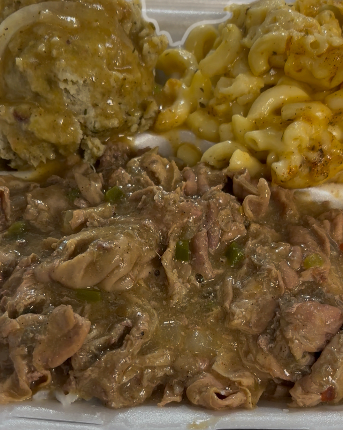 Chiterlings plate with dressing and gravy and mac and cheese from Soulful Eats in Warner Robins.