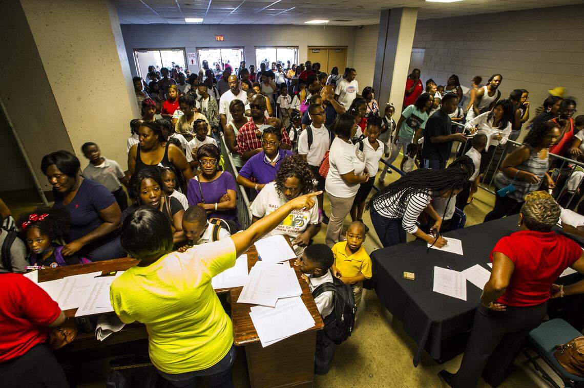 The lobby of the ice rink entrance at the Macon Coliseum was filled with parents and their children checking in for the first day of school at Macon Charter Academy.