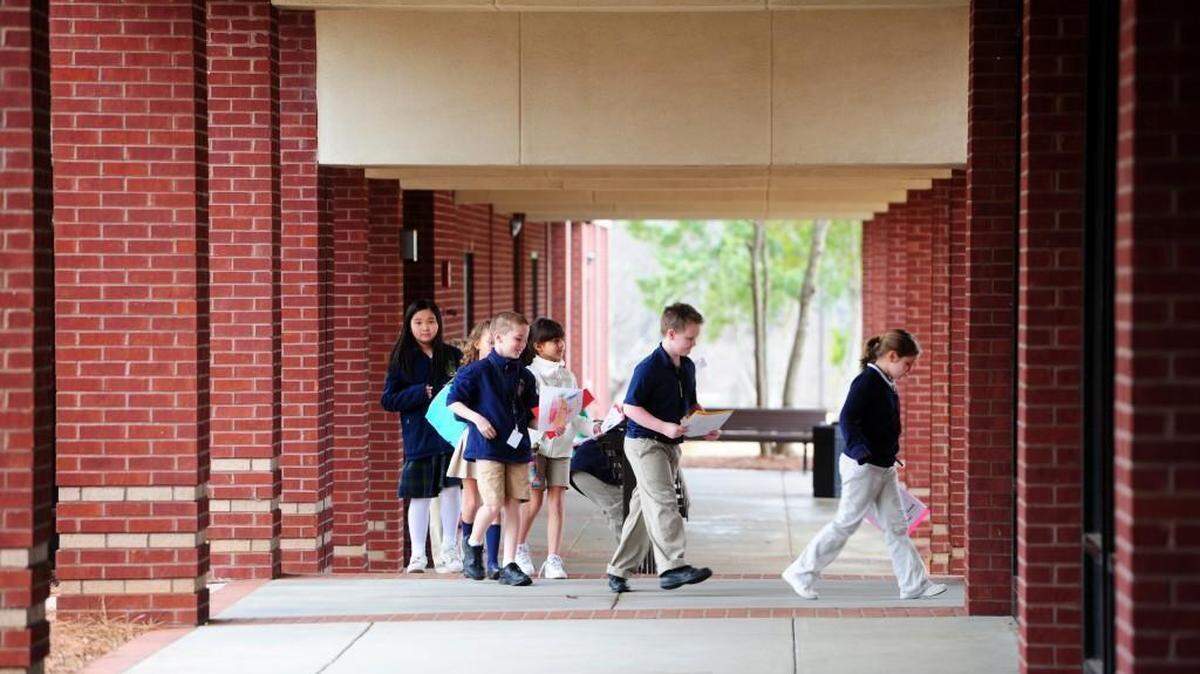 Academy for Classical Education students walk to lunch on a Monday morning in this 2015 file photo.