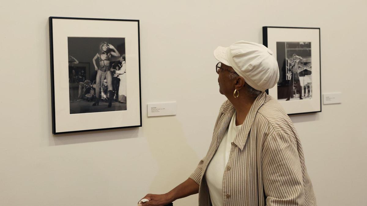Nafeesah Madyun looks at a photograph of Tina Turner taken by Bud Smith as a part of the Thrillers: Black Music in Atlanta 1960s-1990s exhibit on Sunday, July 28, 2024, at the Tubman Museum in Macon, Georgia. The Tubman’s newest exhibit features decades of Black music photography from Atlanta based photographer Bud Smith.