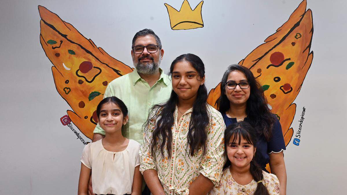Slice & Spice owner Kirti Bhullar, far right, with her husband, Ishtpreet Bhullar, who goes by Jay, and their three daughters, from left to right, Bani, 9, Nanki, 13, and Raavi, 7.