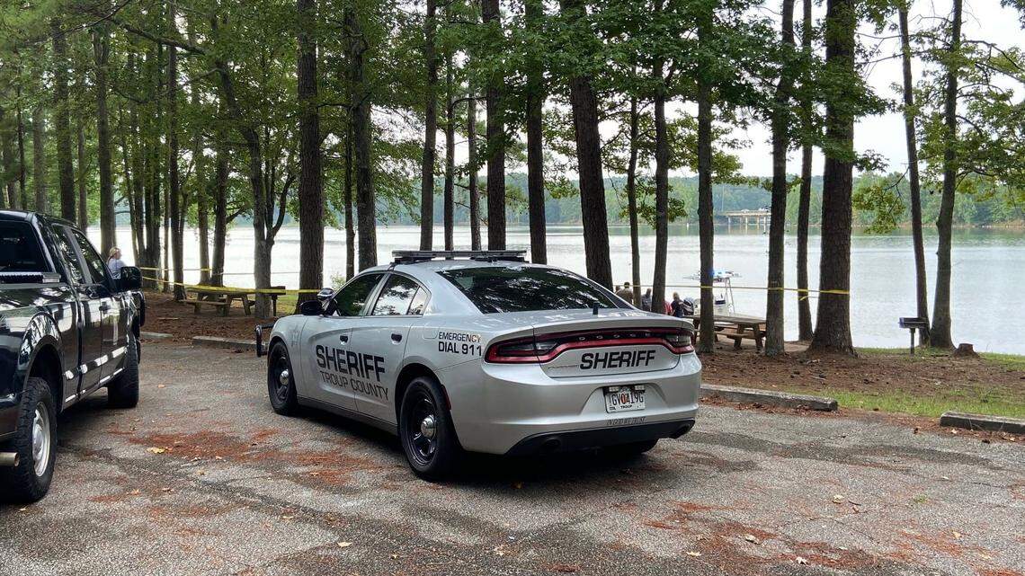 The discovery of two dead men in a Georgia lake has led to the arrest of woman on two counts of “malice murder,” according to the Troup County Sheriff’s Office.