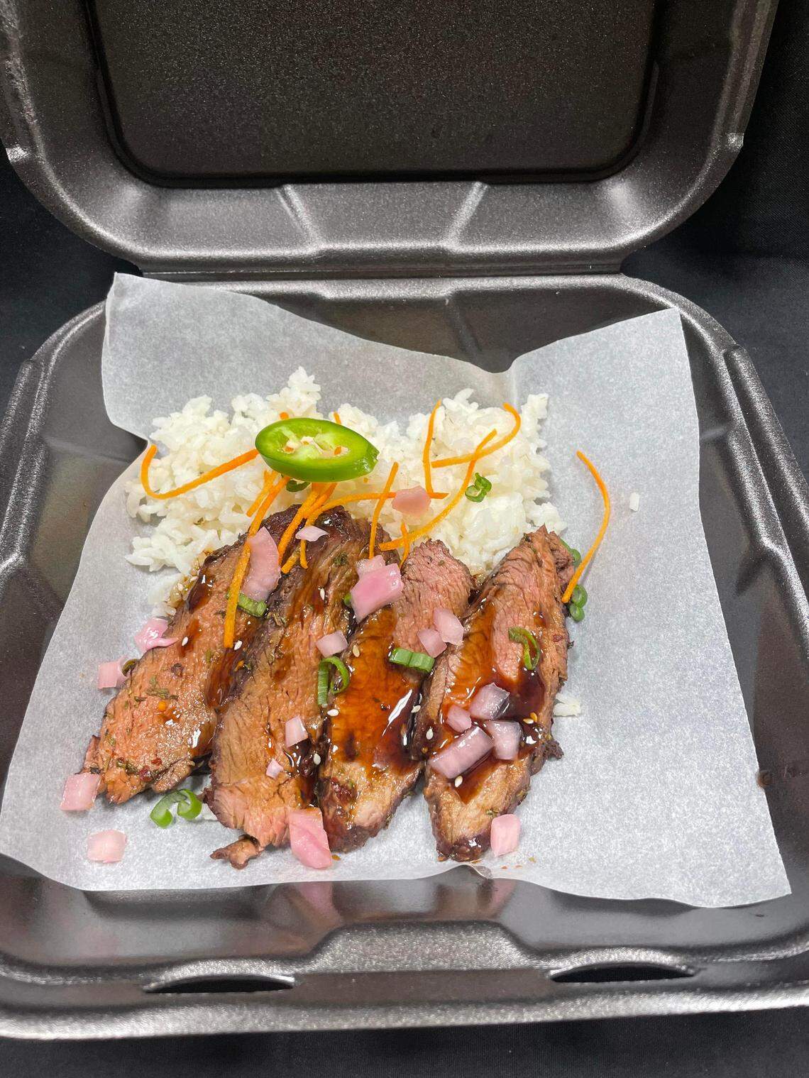 Kalbi beef over garlic fried option is food option featured on the Pan-Pacific menu of the new Root 76 Cuisine food truck.