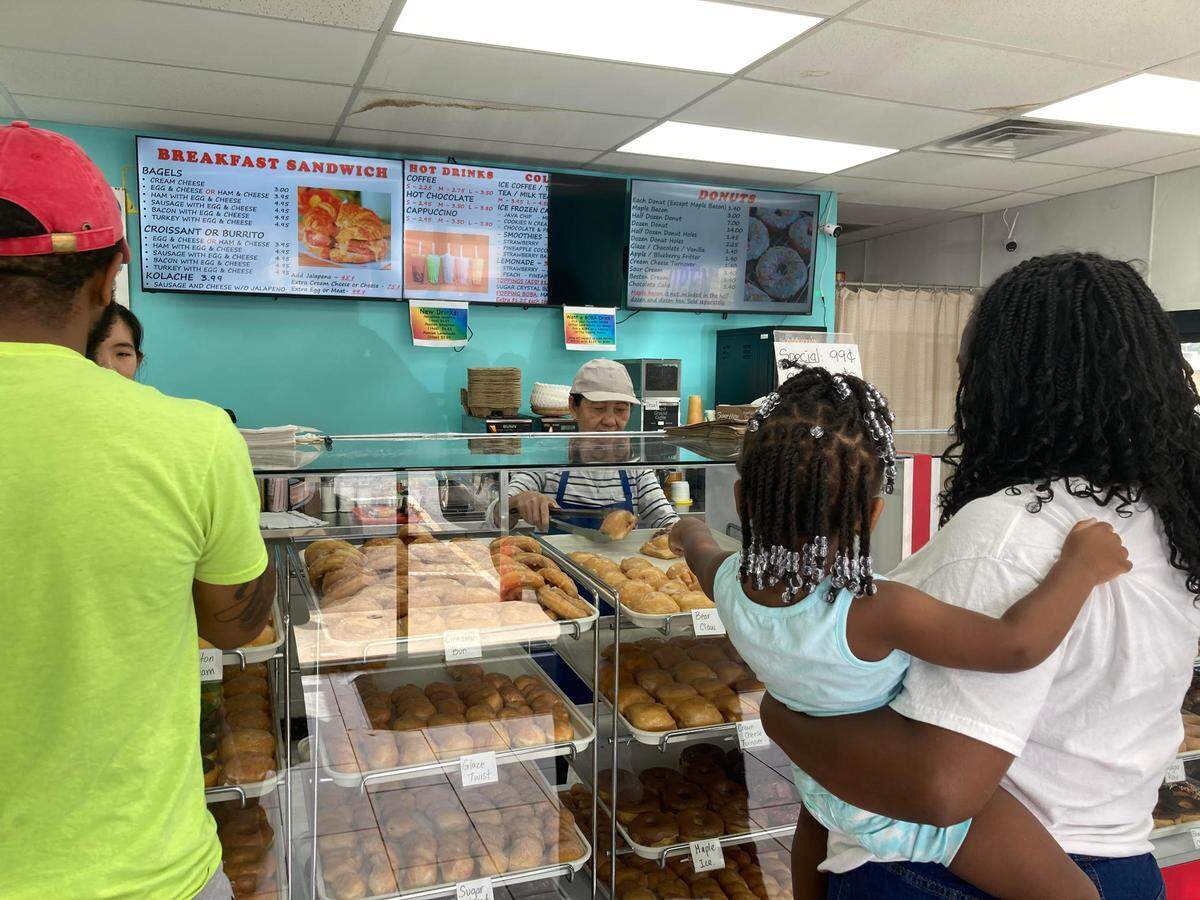 Customers make their selections at Ray’s Donuts in Warner Robins.