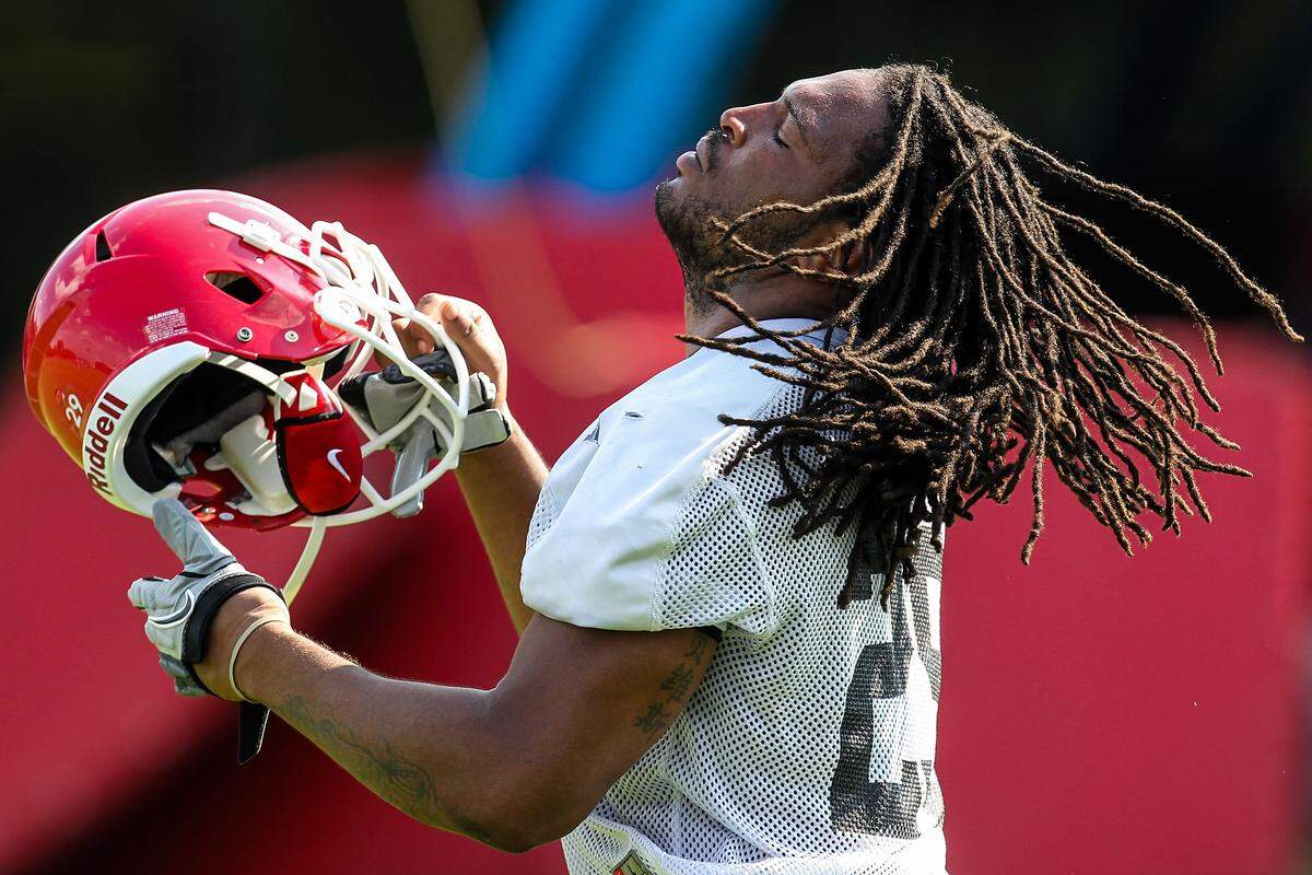 Georgia linebacker Jarvis Jones (29) puts on his helmet during NCAA college football practice, Thursday, Aug. 2, 2012, in Athens, Ga.