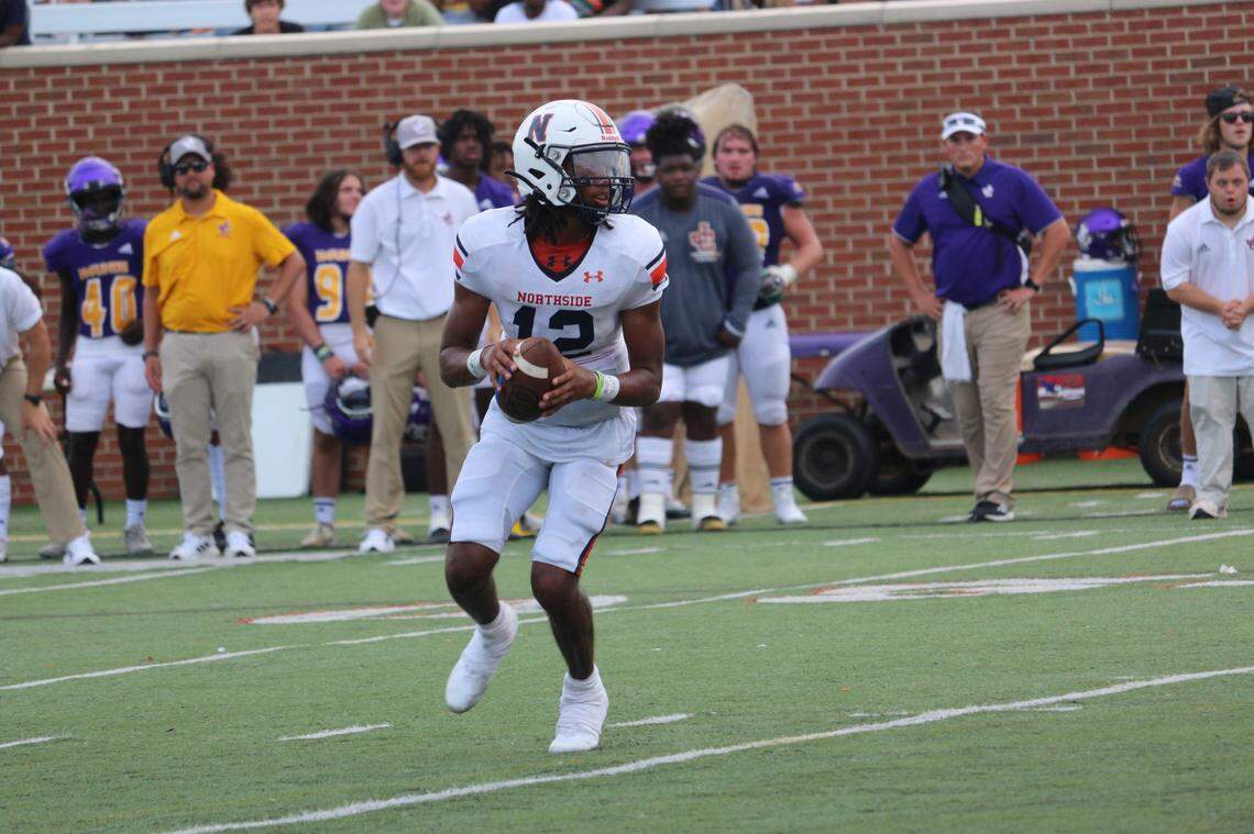 Northside quarterback Damien Dee looks for an open receiver during the Eagles’ 27-21 loss to Jones County Saturday afternoon in Mercer’s Five Star Stadium. The afternoon matchup was part of the Macon Touchdown Club’s Kickoff Classic.