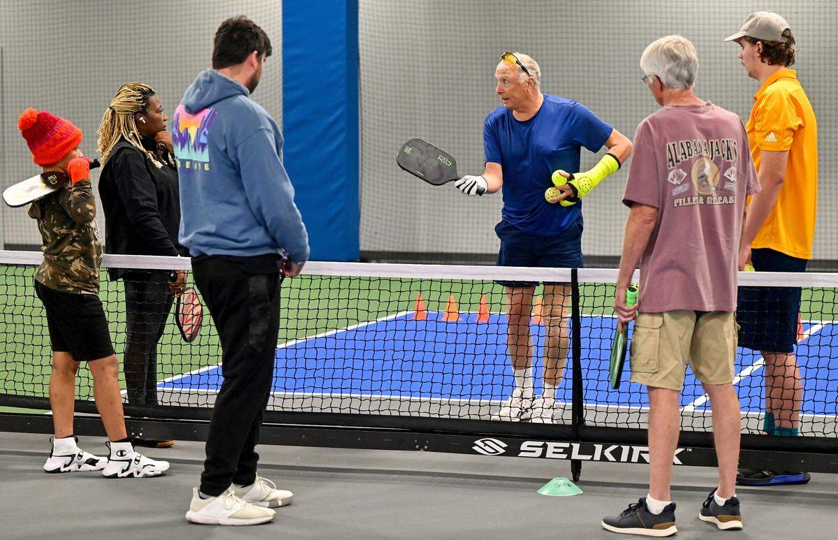 Dave Altman teaches a beginner class Monday morning at the new Rhythm and Rally Sports and Events Center. A grand opening ceremony was held for the facility before opening to the public. With 32 indoor pickleball courts, the facility is currently the largest indoor pickleball center in the world.