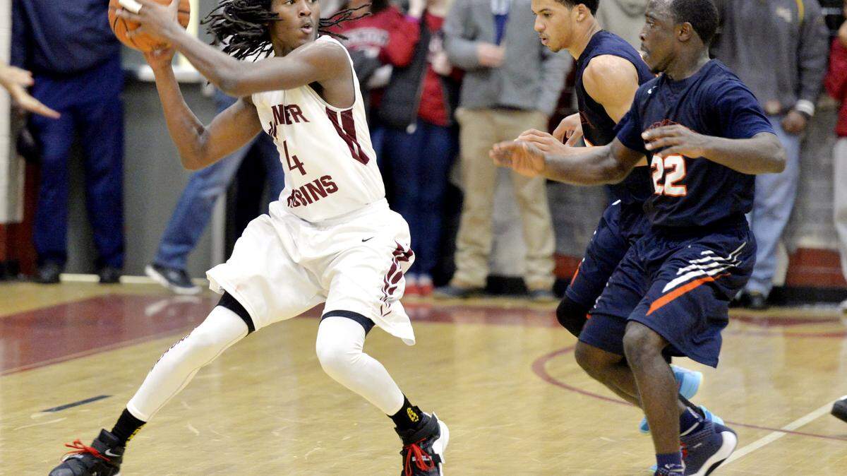 Warner Robins guard Marquez Callaway (24) is pressured by Northside's Trayvon Willis (22) and Tobias Oliver during their game Saturday.