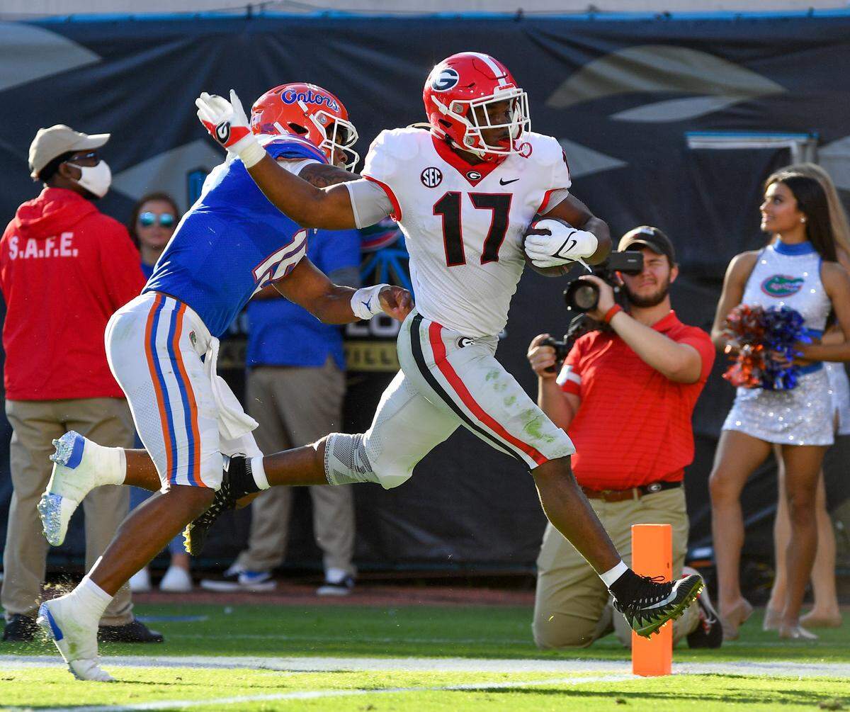DONN RODENROTH,Jacksonville, Florida, 10/30/2021: Nakobe Dean on a pick 6 against Florida.