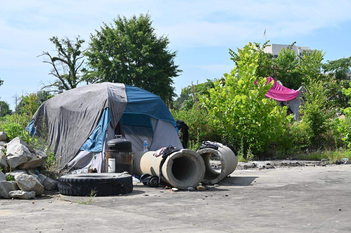 Two make-shift tents were propped up in a homeless encampment on Wednesday, June 11, 2025, near Riverside Drive and Spring Street in downtown Macon, Ga. Two people allegedly died by suicide on train tracks near the camp in 2025.