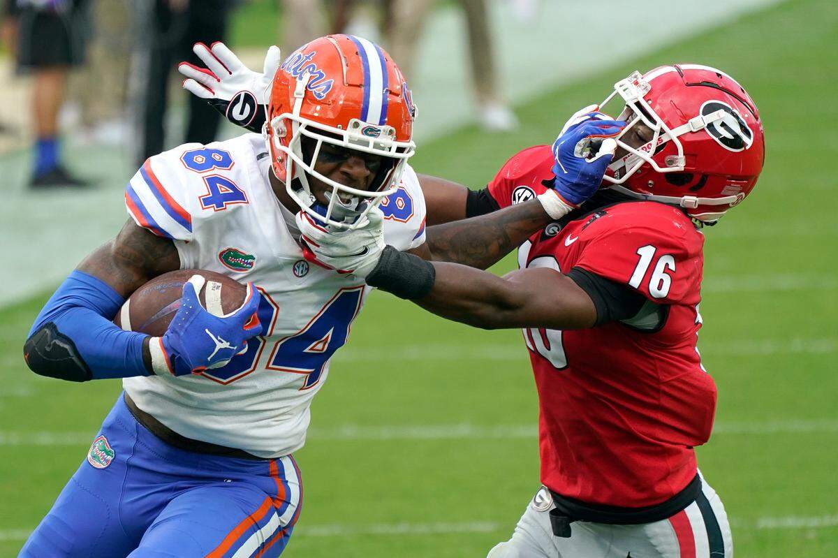 Florida hopes to have injured star tight end Kyle Pitts (84) back for the Kentucky game. Pitts suffered a concussion and had to have nose surgery after a vicious hit from Georgia safety Lewis Cine (16).