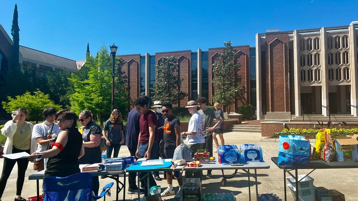 Mercer University students preparing to host a protest at Cruz Plaza.