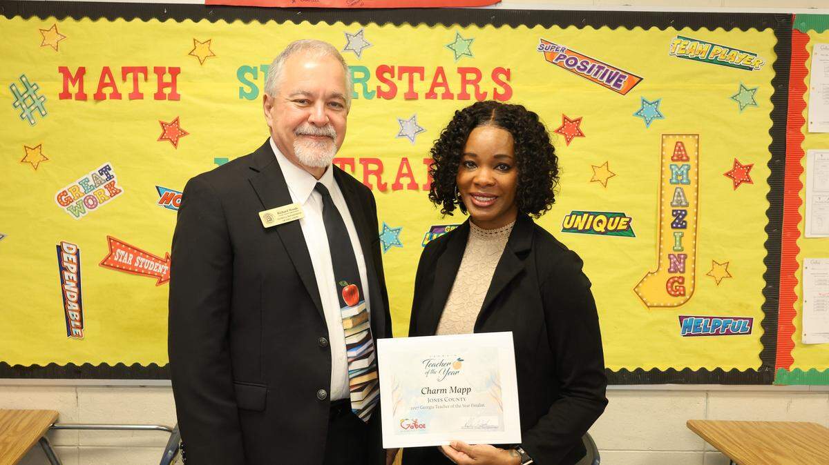 Georgia Superintendent Richard Woods informs Jones County middle school teacher Charm Mapp that she has been selected as one of the state’s ten finalists for 2027 Teacher of the Year Award. Mapp teaches eighth grade at Clifton Ridge Middle School.