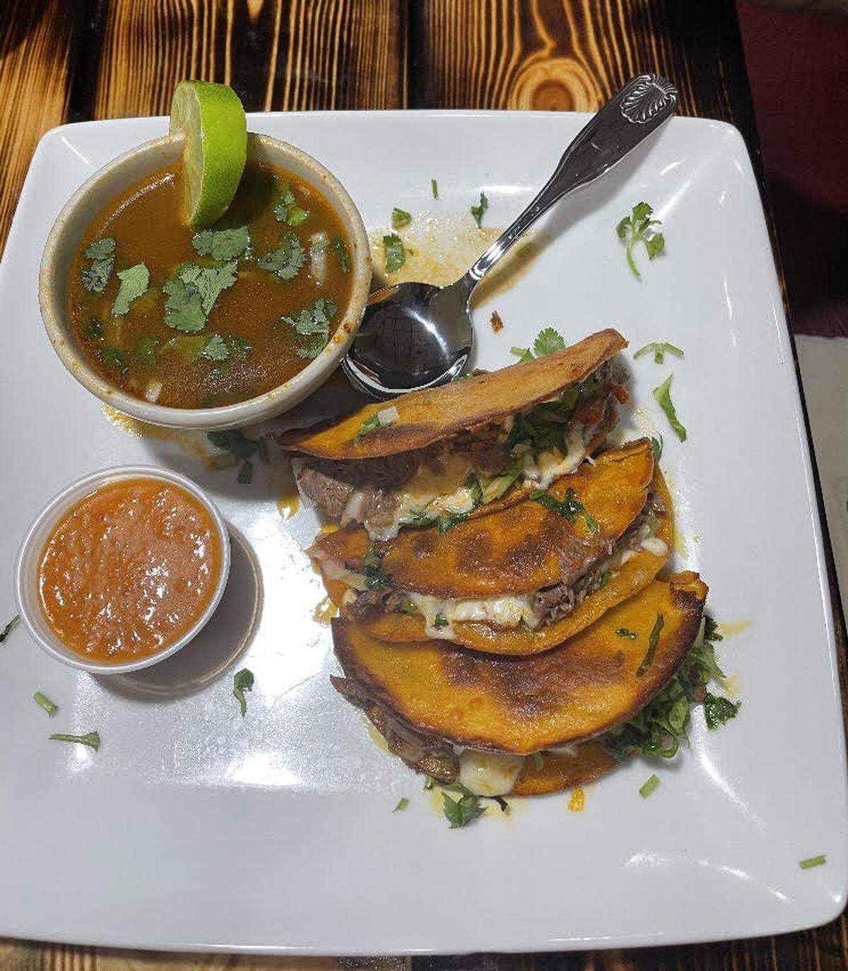 Quesabirrias at Medina’s Mexican Grill at 1281 South Houston Lake Road in Warner Robins. Quesabirrias consist of birria-style stewed meat folded into tortillas that have been soaked in the fat of the meat broth and served with a side of broth for dipping. The photo has been cropped.