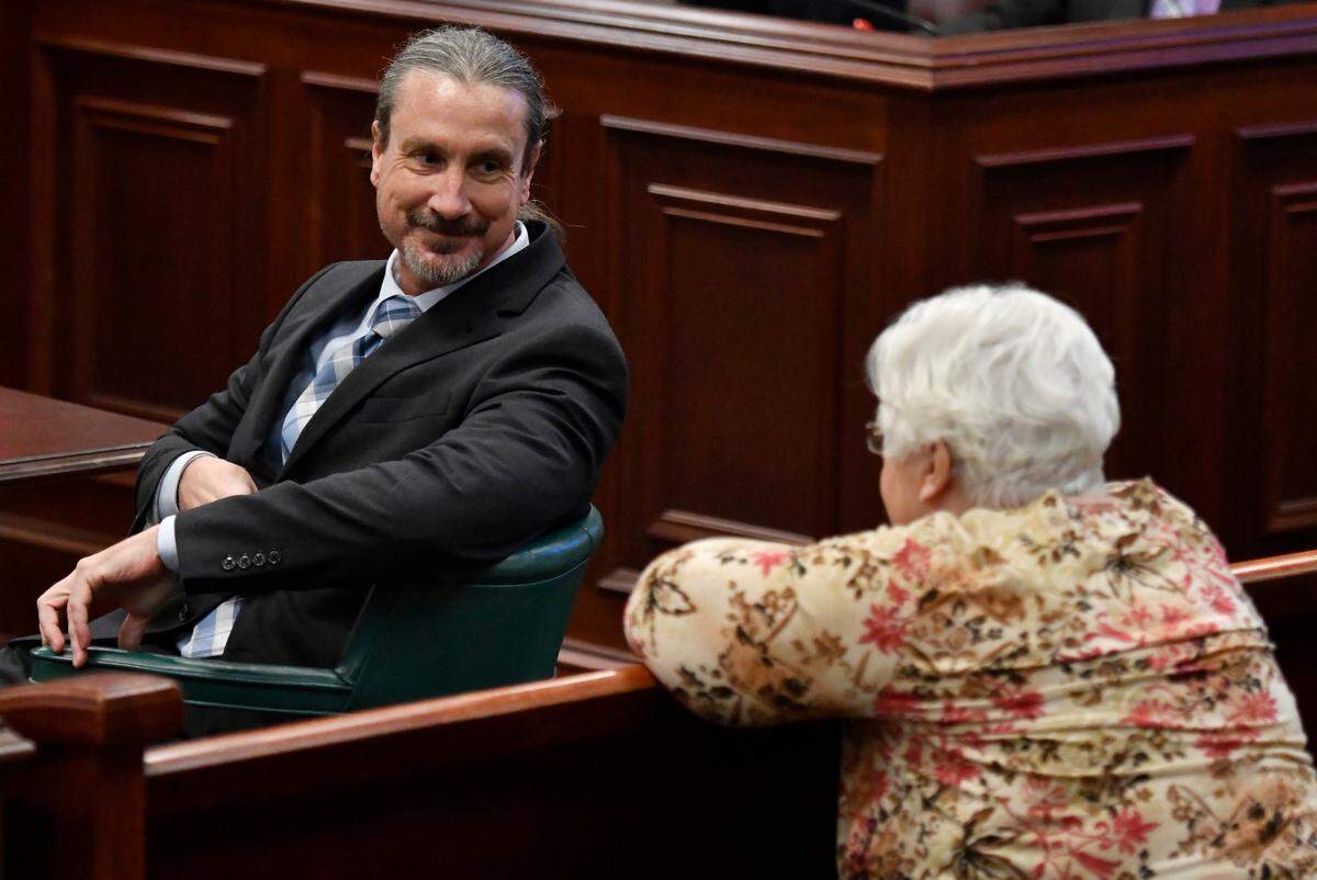 Marcus Lillard speaks with his mother, Elsie Lillard, in a Baldwin County Superior Court on Thursday, April 7, 2022, on the third day of testimony in his murder trial in the 2019 death of his girlfriend, University of Georgia entomology professor Marianne Shockley.