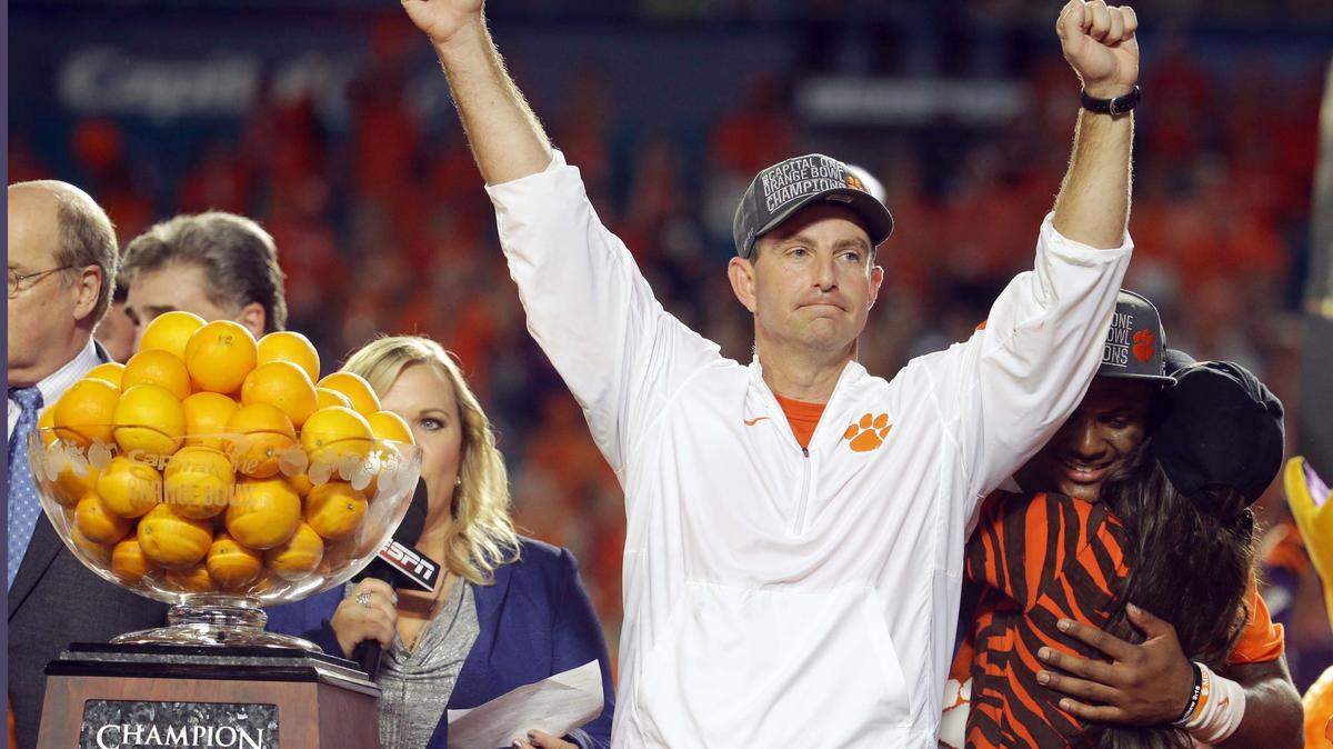 Clemson head coach Dabo Swinney raises his arms after winning the Orange Bowl NCAA college football semifinal playoff game against Oklahoma, Thursday, Dec. 31, 2015, in Miami Gardens, Fla. Clemson defeated Oklahoma 37-17 to advance to the championship game. (AP Photo/Lynne Sladky)