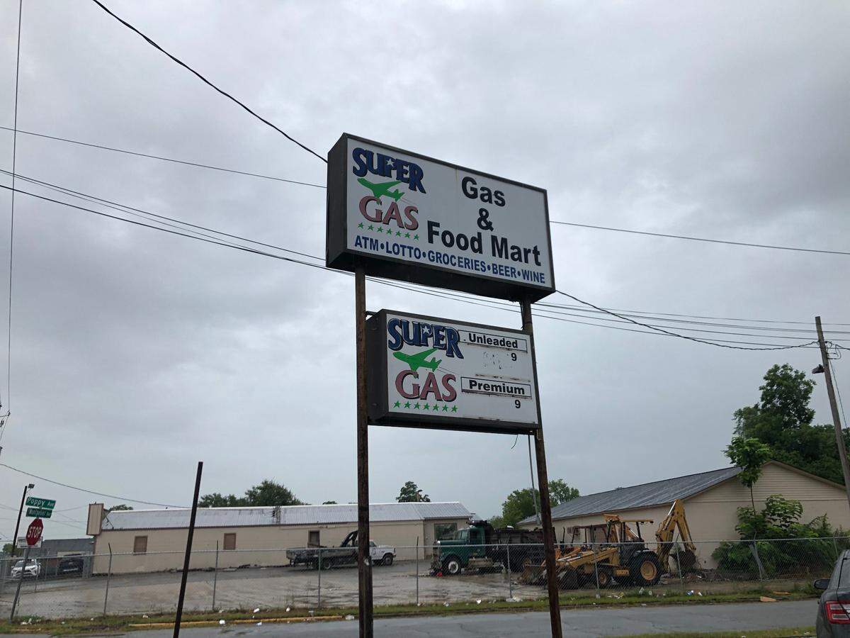 The sign for the gas station and convenience store known as M&M Grocery, which had its alcohol license revoked last week and will face a court hearing Thursday for allegedly leading to violence in the area.