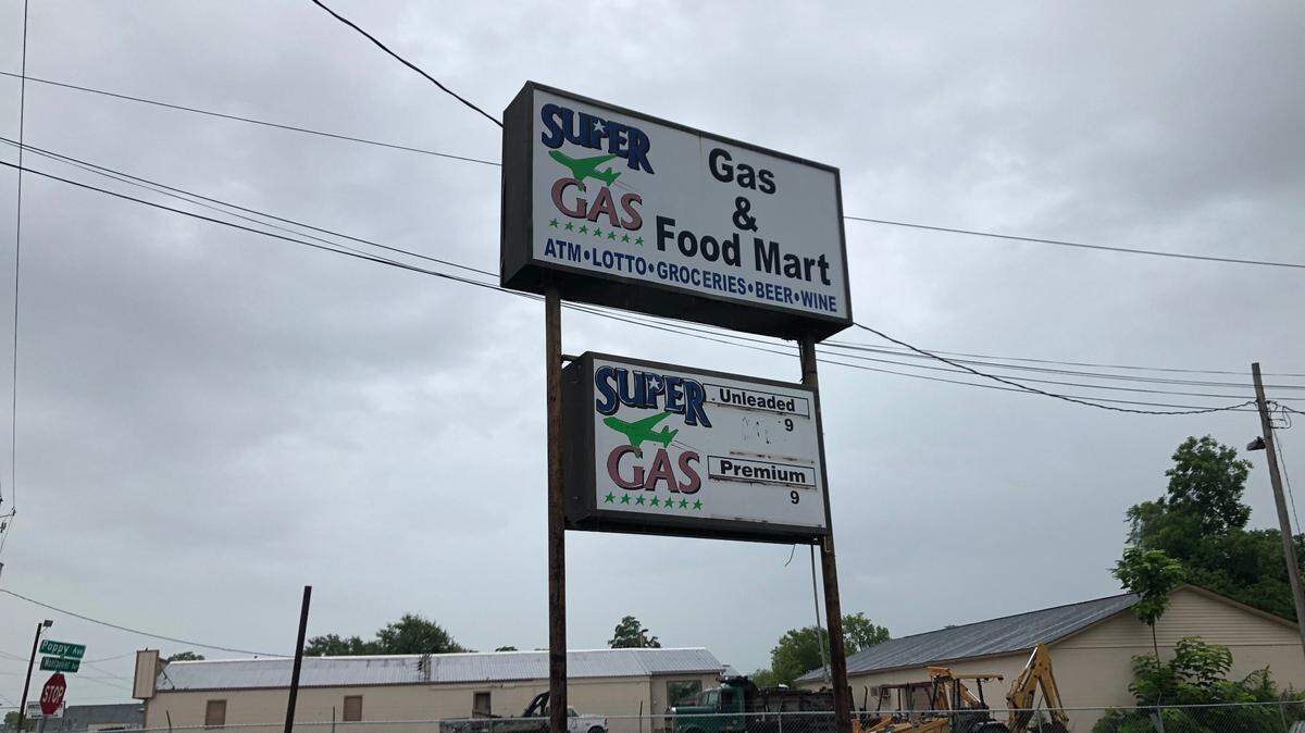 The sign for the gas station and convenience store known as M&M Grocery, which had its alcohol license revoked last week and will face a court hearing Thursday for allegedly leading to violence in the area.