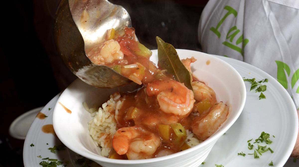 Teddi Wohlford serves her Shrimp Creole, a classic Creole dish, over steamed rice.