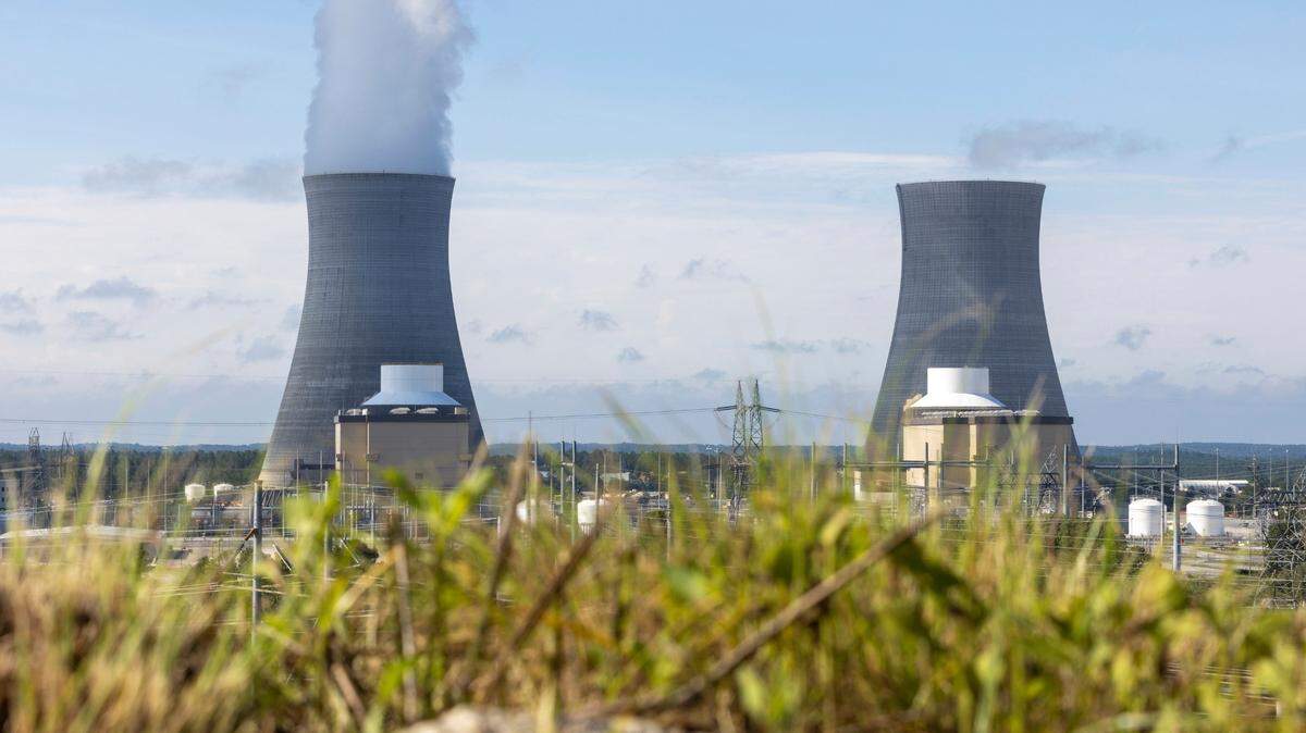 The first of two new nuclear reactors, left, operates at Plant Vogtle, near Waynesboro, Ga., while the second reactor, right, awaits completion. (Arvin Temkar/Atlanta Journal-Constitution via AP, File)