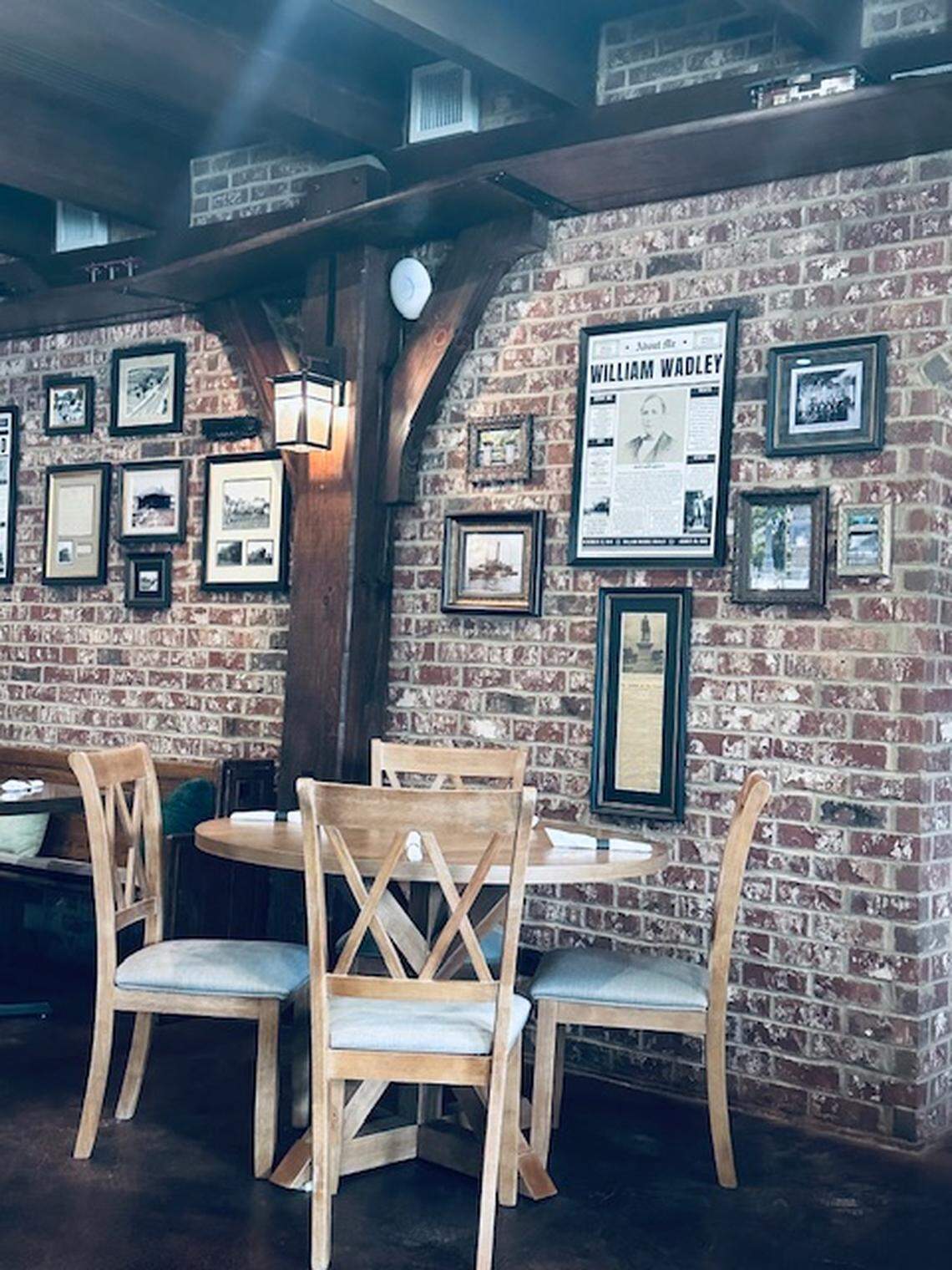 Newspaper clippings on exposed brick in Iron Rail.