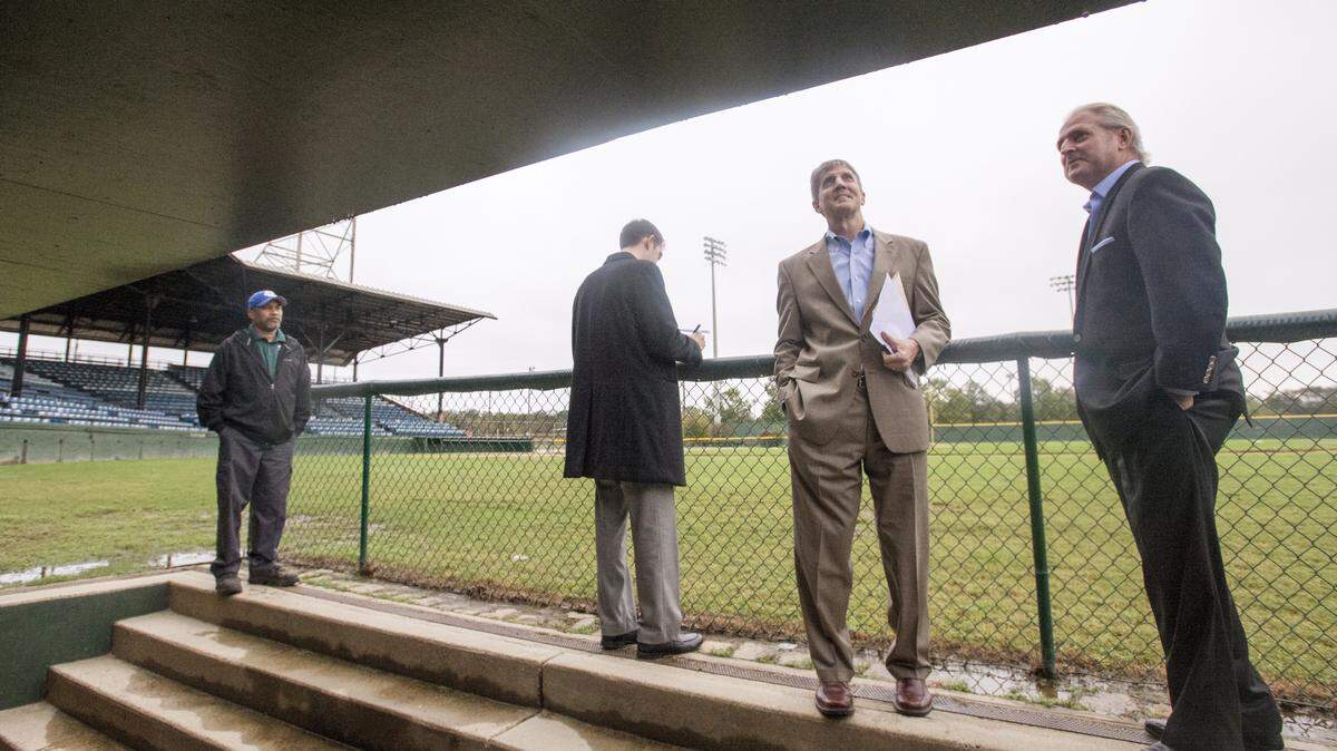 From right, representatives from B&D Venues Rich Neumann, Bill Mykins and Ryan Conway view Luther Williams Field from the home dugout in November. The group toured Luther Williams Field and the site of the former Bibb Mill as part of a feasibility study.