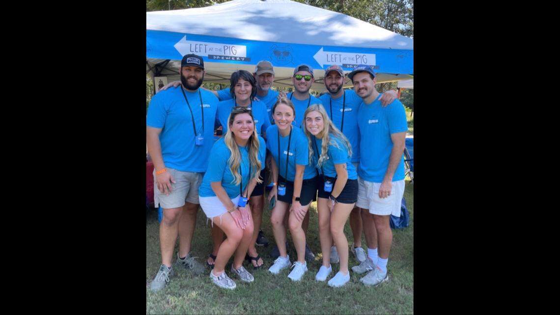 The Forrester family with Left at the Pig Brewing owners Julie and Dave, top row second and third from left, and their sons from left to right, Ty, Drew, Wade and Cam. Bottom row from left to right, daughter-in-laws, Bailey, Tyler and Jacki. Photo taken at the 2022 Brewfest in Perry when a Left at the Pig home brew won the People’s Choice award.