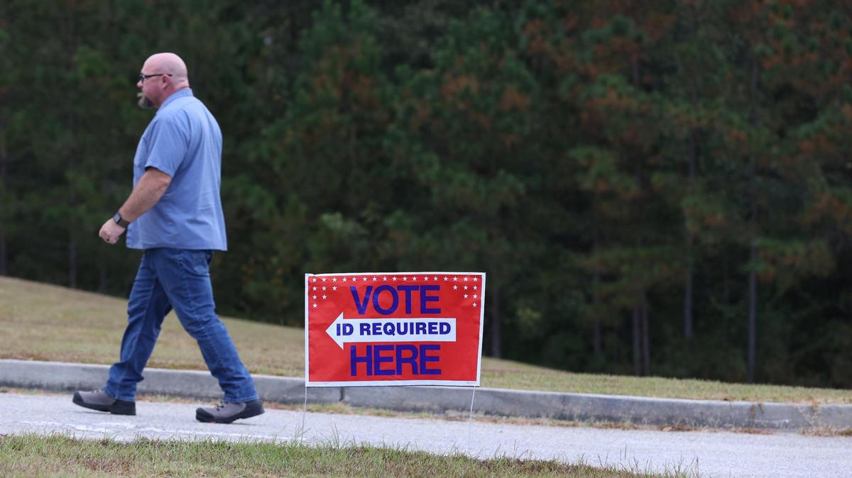 A voter walks towards the polling location at Macon Evangelistic Church within the hour of polls opening on Election Day on Tuesday, Nov. 5, 2024, in Macon, Georgia.