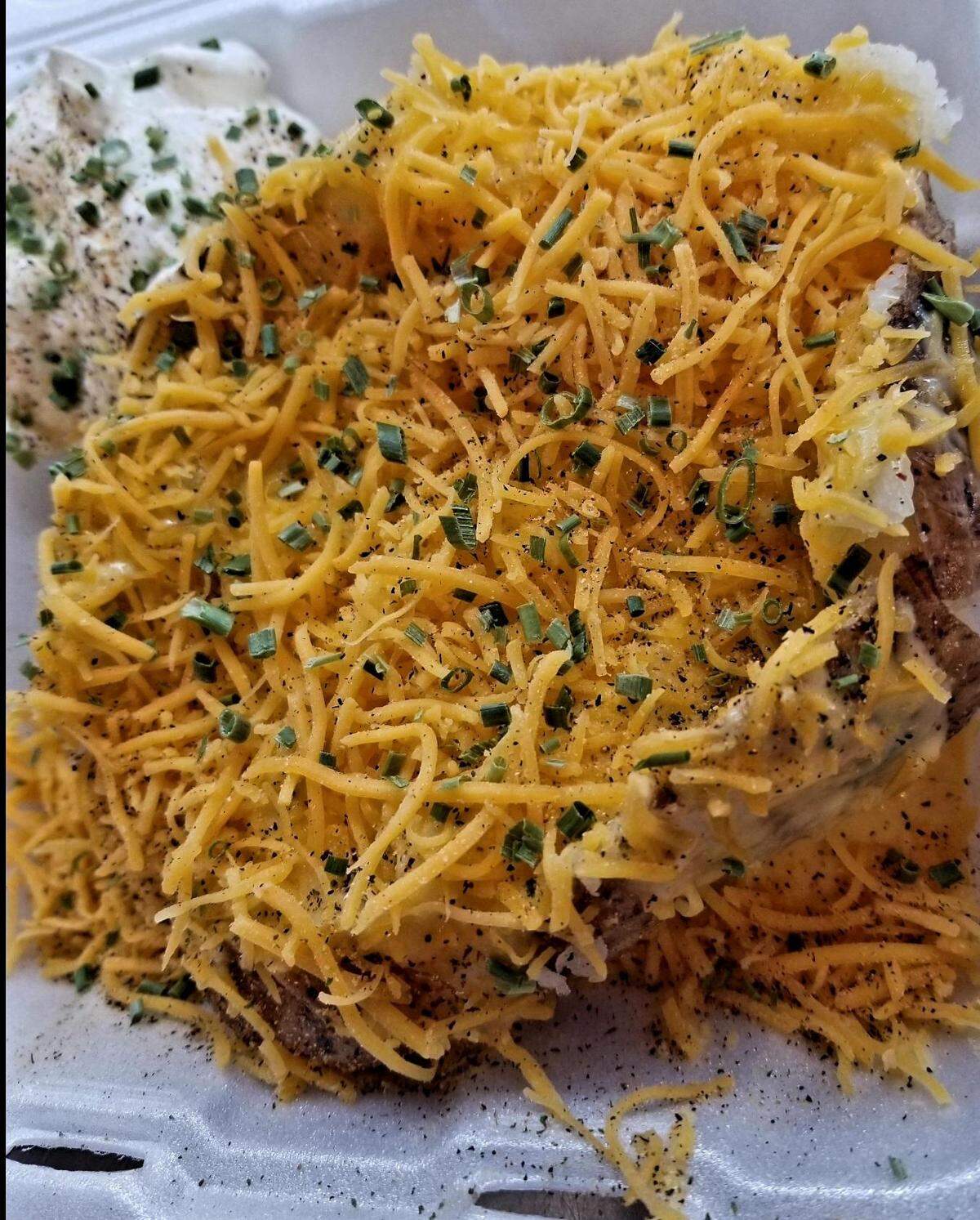 Potato Po-Ta-Toe at 778 Ga. 96, Suite 135, takes baked potatoes to the next level. This one is draped with homemade cheese sauce called cheddar cheese drip and sprinkled with seasoning referred to as tater dust and with chives. Sour cream is optional.