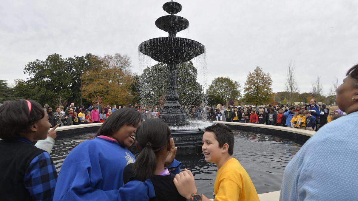 Excited Alexander II students wiped tears of joy as the new fountain at Tattnall Square Park was turned on for the first time Thursday, Dec. 3, 2015.