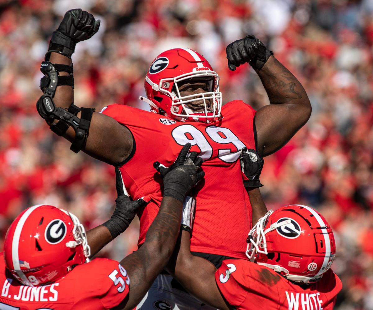 Georgia senior defensive lineman Jordan Davis celebrates scoring a touchdown in the first quarter of action against Charleston Southern Saturday in Athens. Georgia leads Charleston Southern 49-0 at the half.