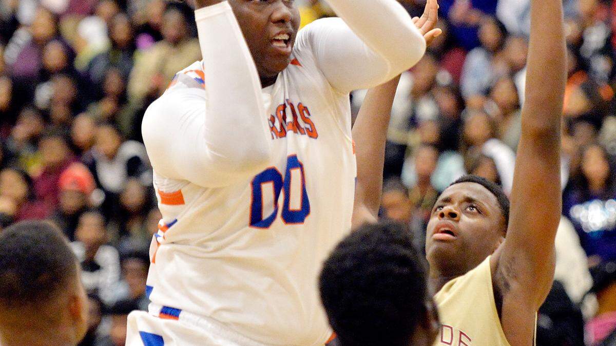 JASON VORHEES/THE TELEGRAPHCentral's Kentrevious Jones (00) puts up a shot in the lane during the Chargers' game against Westside Tuesday night.