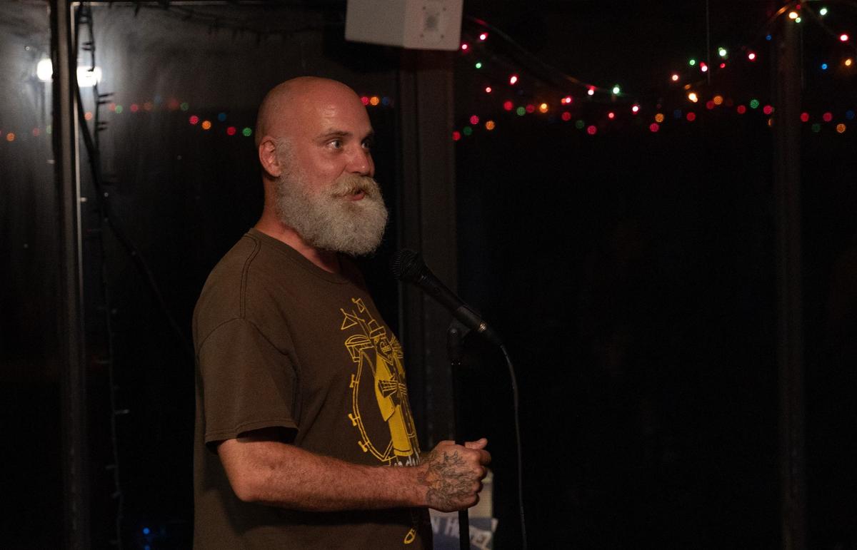 Peter Revard, or “Pistol Pete,” invites the next singer up for karaoke at T & Jay’s Bar on Tuesday, May 14, 2024, in Macon, Georgia. Revard hosts karaoke weekly on Tuesday nights.