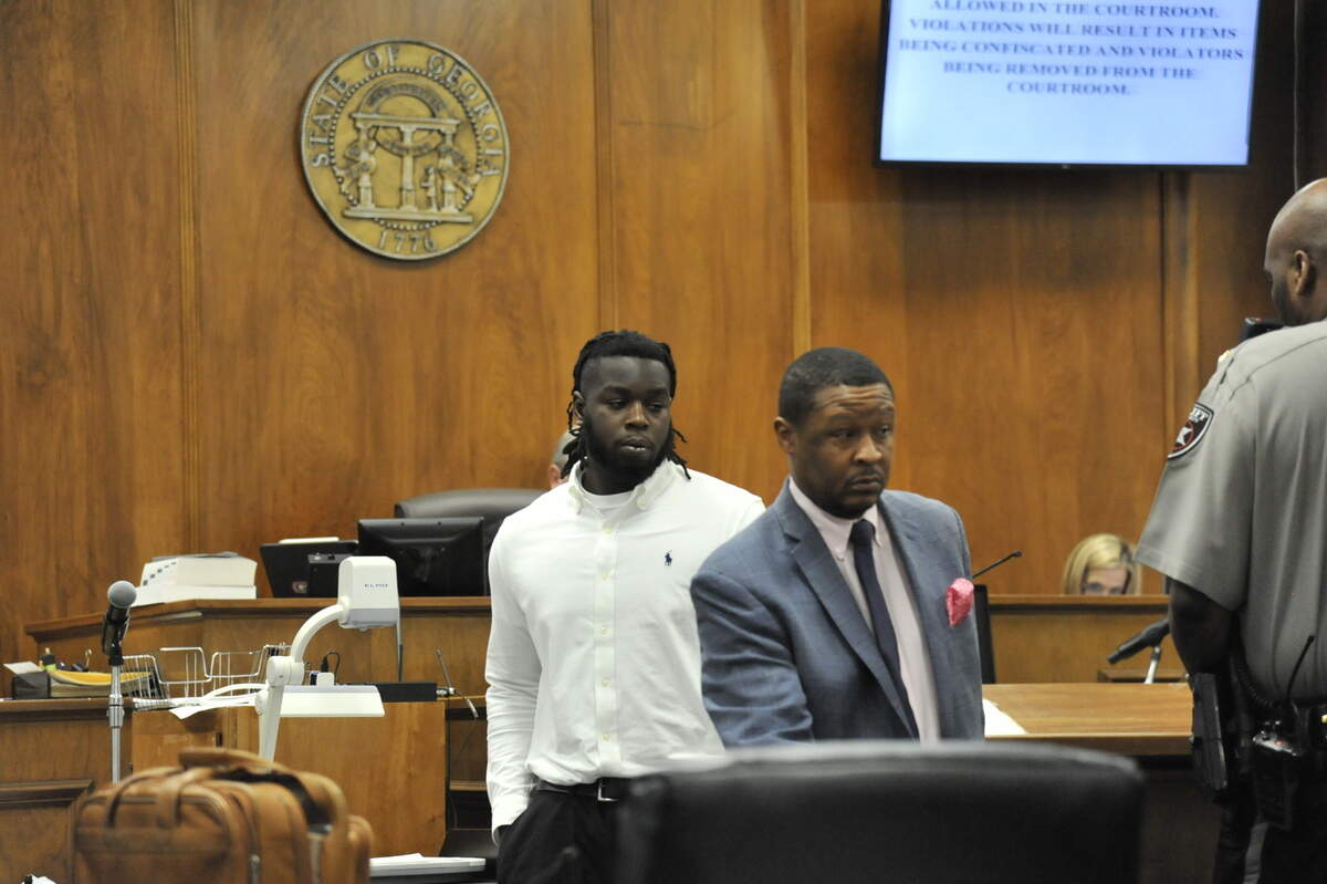 Dawan Jasentay Daniels Jr., left, with his attorney Melvin Raines II during a hearing in Bibb County Superior Court on Thursday, March 23, 2022, where Daniels pleaded guilty to voluntary manslaughter in the 2018 shooting death of Da’Kwaun Faulks, 18.