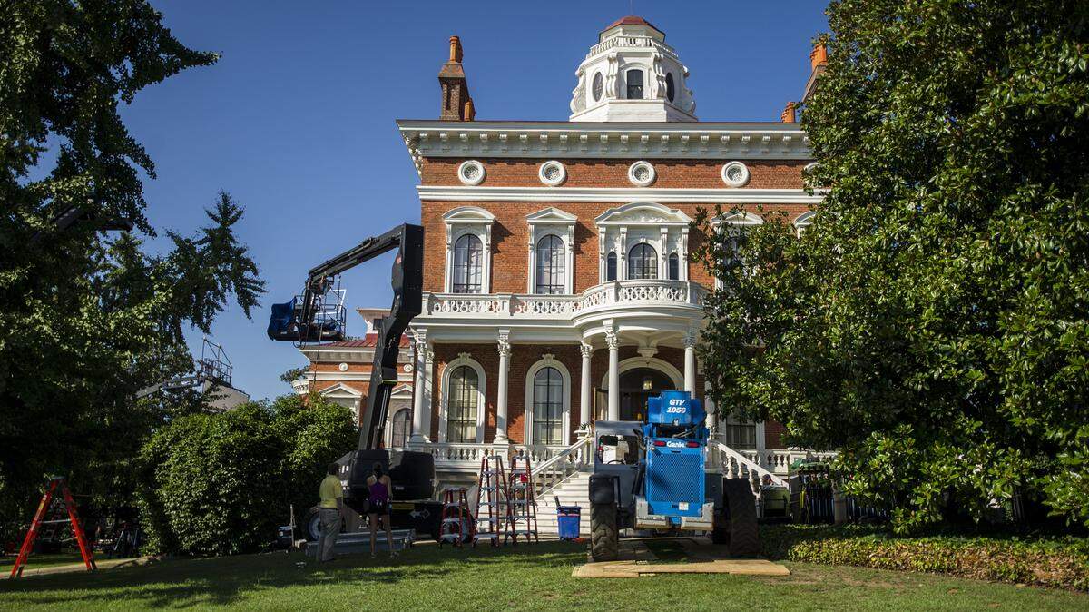 A production crew works on the Hay House grounds Wednesday morning.