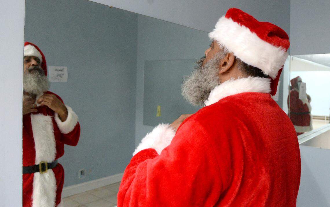 Dwight Miller, also known as Pop Popp Santa, checks out his suit prior to starting his shift Tuesday at the Houston County Galleria. According to the Galleria’s manager, Miller is the first Black Santa at the mall.