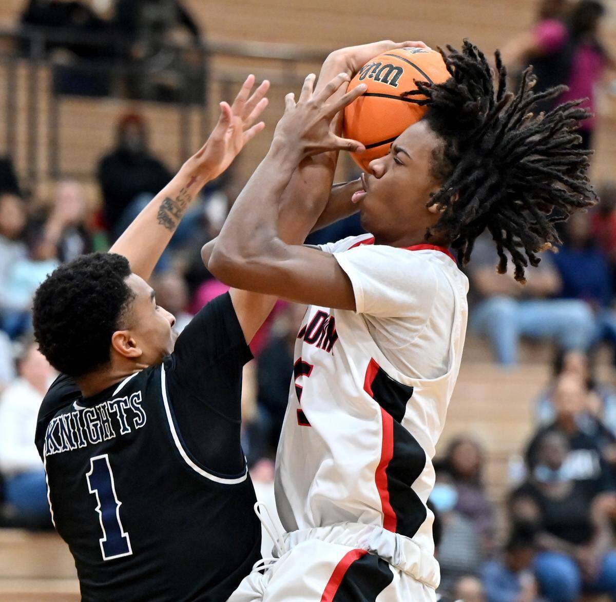 Baldwin’s Kenneth Kelsey (5) has his shot blocked by Pace Academy’s Kyle Greene (1) during their GHSA 4A quarterfinal game Wednesday night. Pace won the game 62-31.