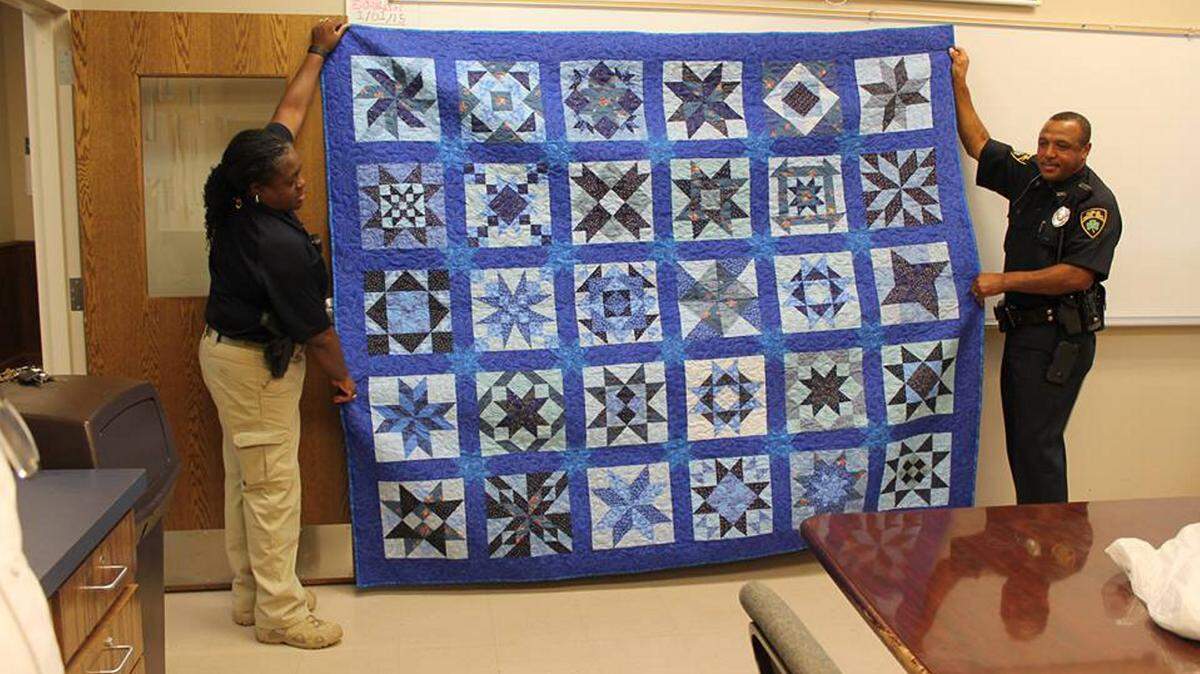 Special to The Telegraph 
 Dublin police are raffling a handmade, queen-size quilt during Thursday's Fall Festival at the Market on Madison.